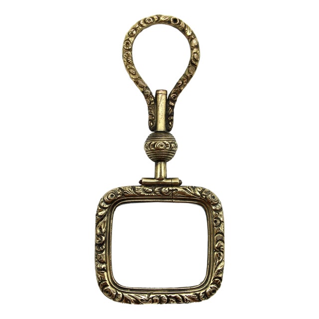 Mid 19th Century Georgian Pinchbeck Quizzing Glass With Floral Motif and Swivel Handle For Sale