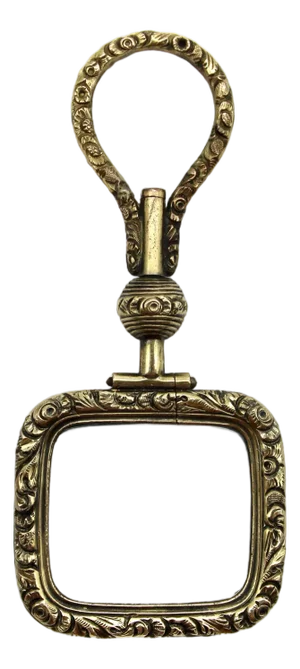 Mid 19th Century Georgian Pinchbeck Quizzing Glass With Floral Motif and Swivel Handle