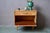Here's a retro bedside table with simple, yet stylish compass legs. The drawer and hinged cabinet offer ample storage, and...
