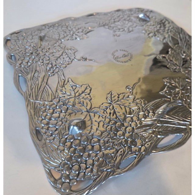 This is the original aluminum serving platter - what started the whole fuss. Gorgeous grapevines intricately carved into...