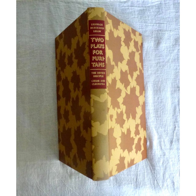 This is a 1979 Heritage Press edition of George Bernard Shaw's plays, : “The Devil’s Disciple” (1897) and “Caesar and...