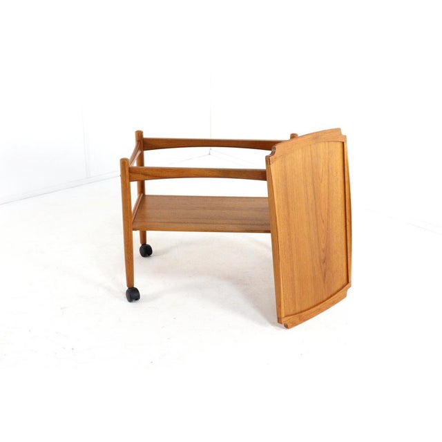 Beautifully designed trolley made of teak. Its beautiful timeless look this trolley owes to the flowing lines in the...
