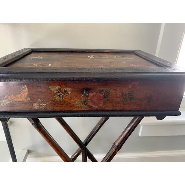 Antique sewing table with beautiful inlay. Nearly perfect condition. Works with any decor. Small enough to fit any room...
