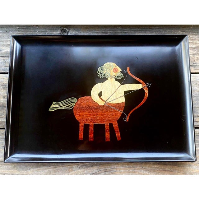 A wonderfully graphic vintage Couroc of Monterey tray depicting Sagittarius, the Archer, as the classical centaur drawing...