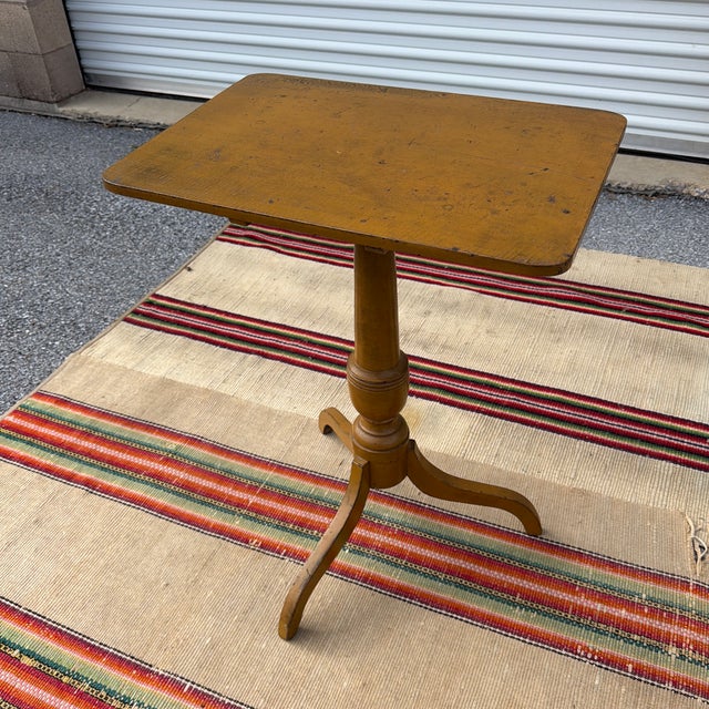 Antique Pennsylvania Spider Leg Candlestand in Mustard Yellow Paint, Circa 1820s A wonderfully characterful and visually...