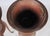 An exceptionally graceful matched pair combining warm carved wood, airy hand caning, and beautifully aged copper liners. A...