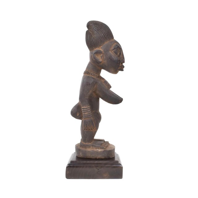 Ibeji figures, carved by the Yoruba people of Nigeria, are wooden twin sculptures holding cultural significance in Yoruba...