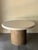 Resin and marble terrazzo round table top with textured cylindrical base. The base is made of a textured “bark” like...