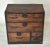 An antique Japanese tansu chest, original hand forged iron hardware and wiped lacquer finish. Five drawers of varying...