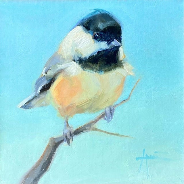 This oil on linen painting features a delicate bird perched on a slender branch against a serene blue background. The soft...