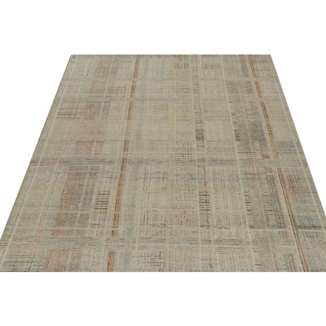 A 9x12 abstract rug, hand-knotted in distressed style wool from Rug & Kilim’s Homage Collection. Further on the Design:...