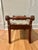This is a vintage footstool or window bench by the Biggs Furniture Company of Richmond, Virginia, retaining its original...