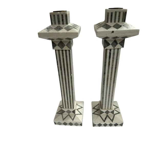 Set of two vintage Tavola marble candlesticks, their sleek forms carved from luxurious grey and white marble. The natural...