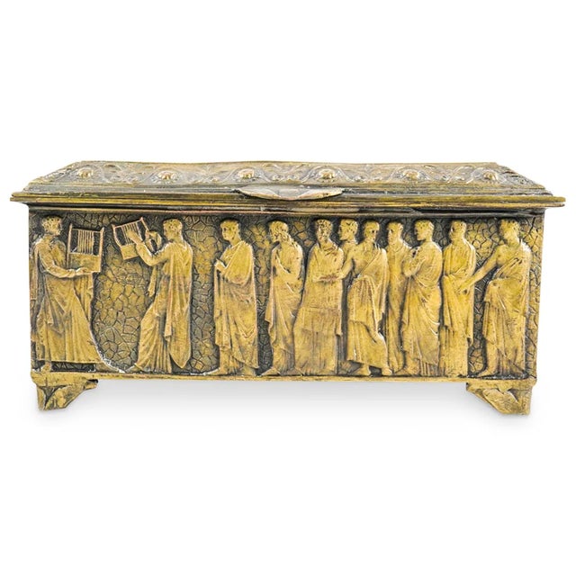 Elevate your collection with this exquisite antique brass jewelry box, featuring masterfully detailed Greek Revival relief...