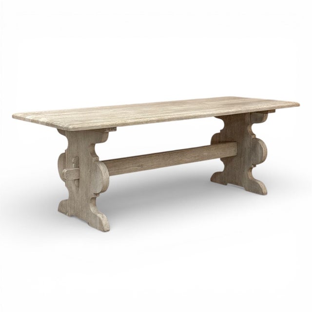 A substantial rustic French country dining table crafted in solid oak, generous in size and presence. The table has been...