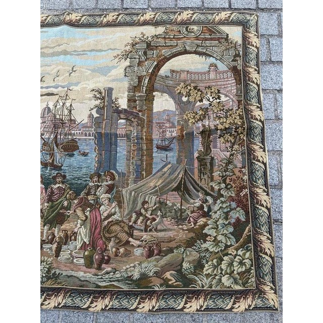 Discover the timeless elegance of this exquisite vintage French tapestry representing a 17th Century view of the ancient...
