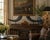 A sophisticated pair of vintage faux ram horns mounted on substantial black marble plinths, offering the timeless sporting...