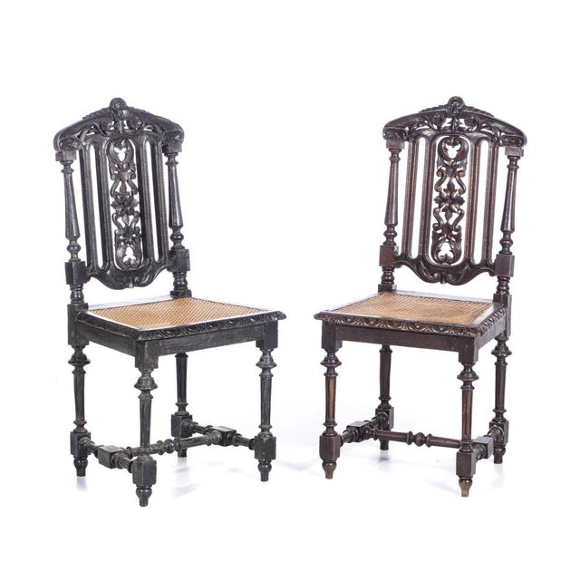 Portuguese, 19th century, carved oak wood, openwork backs, straw seats. Decorated with plant motifs. Dimensions: 101 x 47...