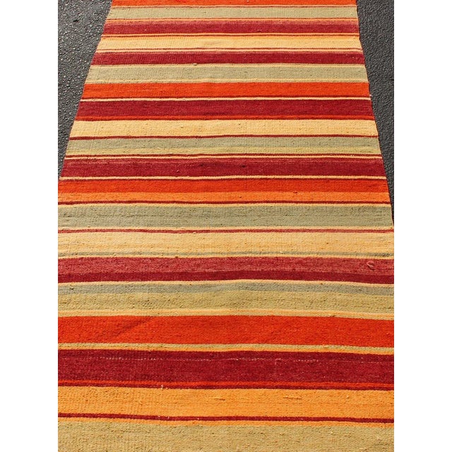 Mid 20th Century Vintage Hand Woven Turkish Kilim Runner With Stripes in Red, Green, Yellow, and Orange For Sale - Image 5 of 11