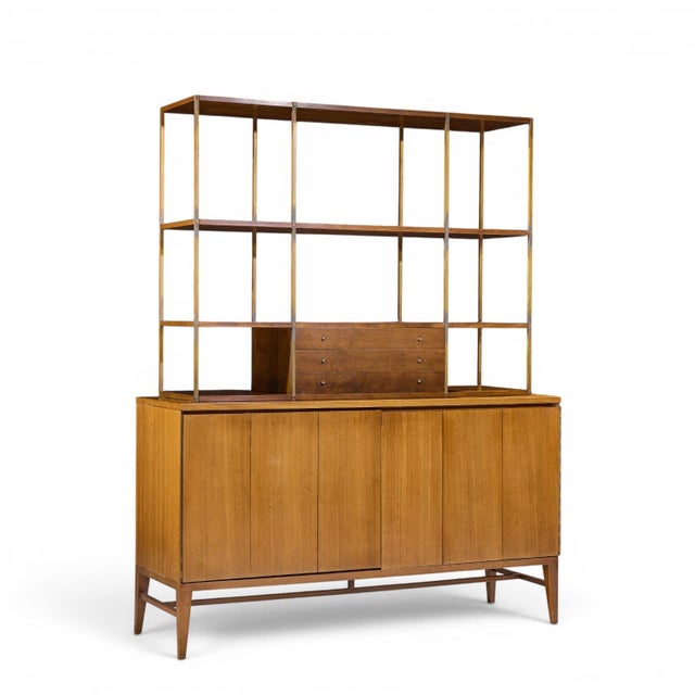Paul McCobb for Calvin Mid Century Walnut and Brass Room Divider Credenza with Hutch The credenza measures: 60 wide x 19...