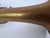A distinctive vintage french brass instrument by j. Gras, paris, featuring an elegant elongated silhouette, a broad flared...