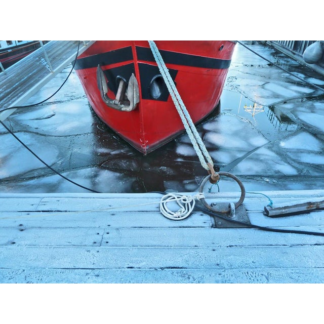 Stockholm Red, 2014 by Jo Crowther is a 16" x 20" Archival Inkjet Print The icy water of this Stockholm dock is the center...
