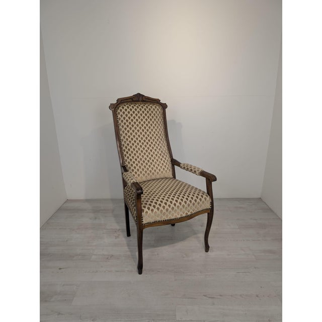 Antique Louis XV Style Armchair Stylish, antique Louis XV style armchair with springs. Crafted from wood and upholstered...