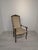 Antique Louis XV Style Armchair Stylish, antique Louis XV style armchair with springs. Crafted from wood and upholstered...