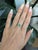 This elegant Colombian emerald ring is crafted in solid 14K gold and features a stunning 7.5x8mm oval-cut emerald with...