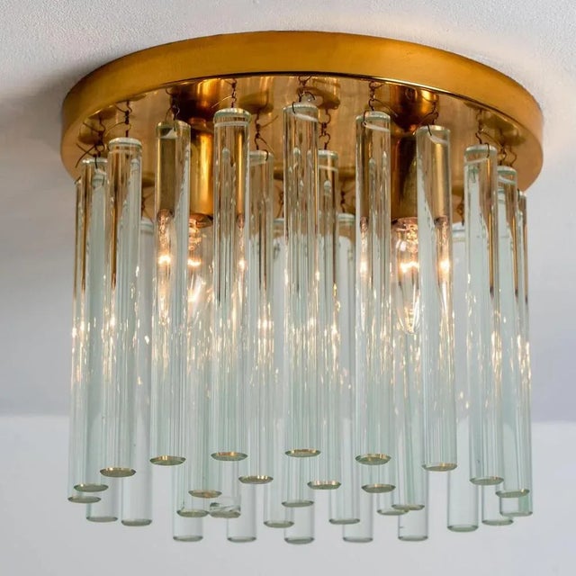 High quality Mid-Century brass and clear crystal glass flush mount by Ernst Palme, Germany, 1970s. The flush has a brass...