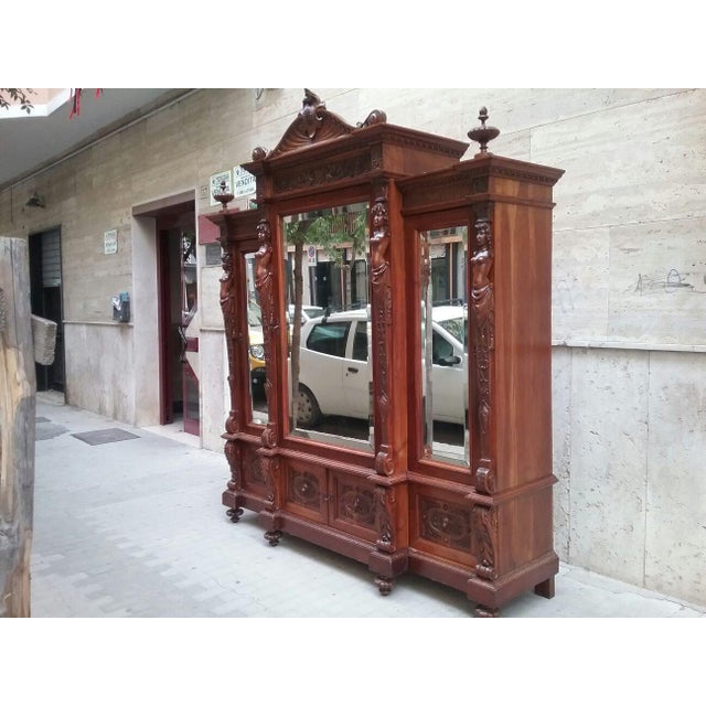 Antique wardrobe in solid walnut wood with mirrored doors, authentic from the early twentieth century in Baroque style In...