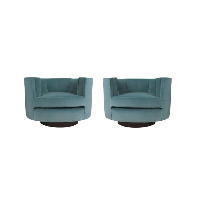An exemplary and very rare pair of tub swivel chairs designed by Milo Baughman, circa 1960s. His signature style, defined...