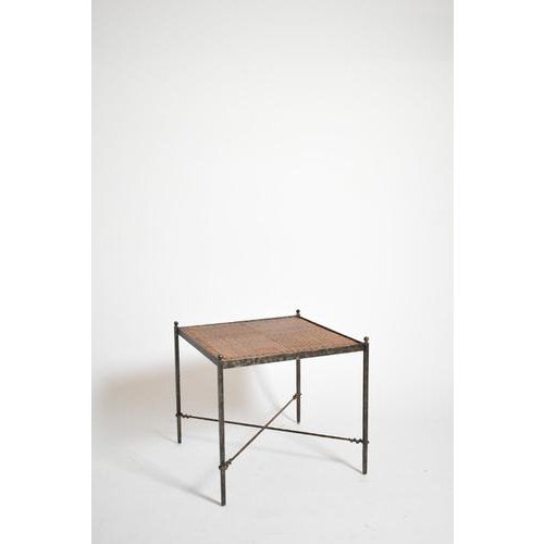 Pair of wrought iron and wicker side tables, 1970s. Height: 59 cm - 23.23 in Length: 63 cm - 24.8 in Width: 63 cm - 24.8...