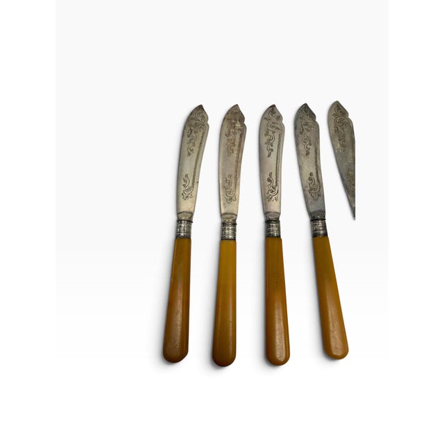 Elevate your next dessert course or afternoon tea with this striking 12-piece antique fish or dessert cutlery service for...
