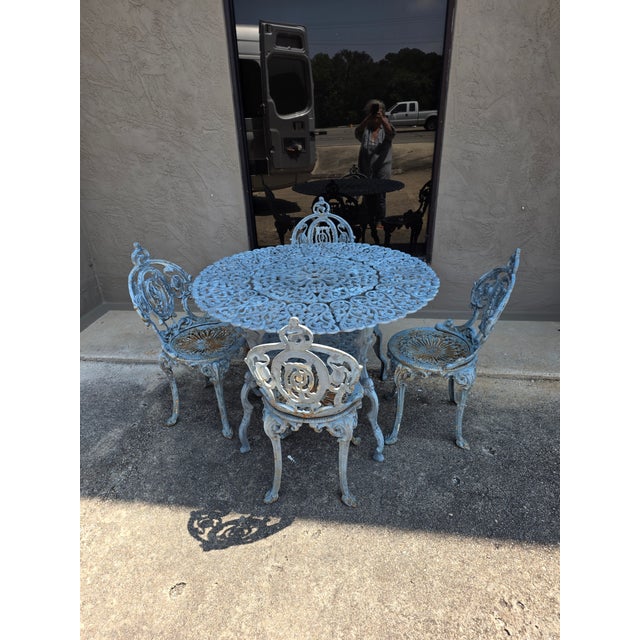 The chairs are heavy cast iron and very old possibly antique. The screws have been changed out on three of the four...