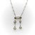 This platinum Edwardian negligee necklace features four Old Mine Cut diamonds and a diamond encrusted halo element. The...
