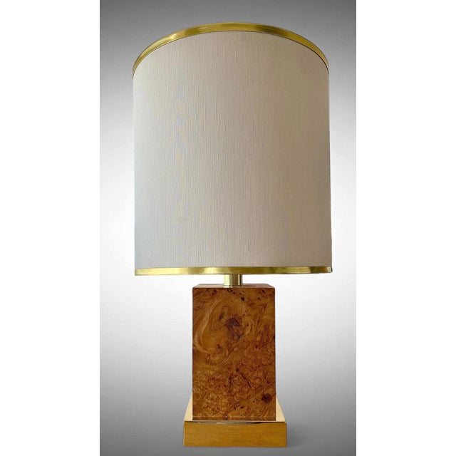 Stunning majestic table lamp, Italy, 1970s. Brass base, burl wood and a large cotton lampshade refined with a brass rim at...