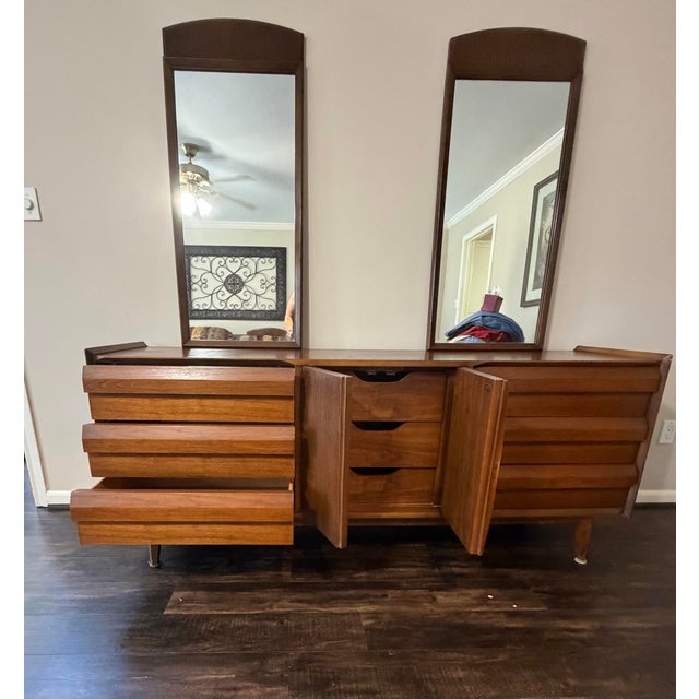 Authentic vintage Lane Furniture triple dresser with two original matching mirrors. This beautifully crafted piece...