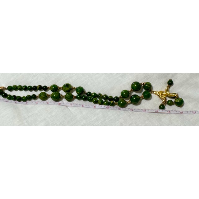 1950s Bakelite Pendant Necklace With Green and Yellow Marbled Beads and a Gold Tone Monkey Pendent Holding Beads Excellent Pre Owned Condition For Sale - Image 11 of 12