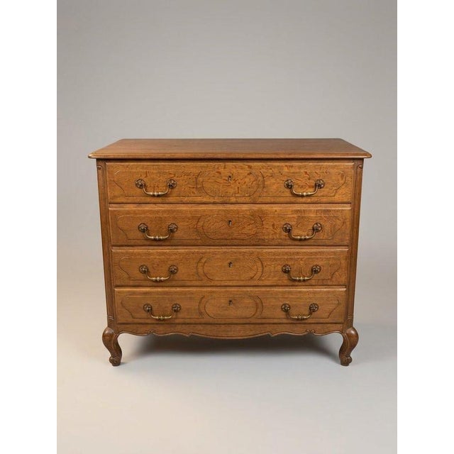 A fabulous and stylish early 20th-century French chest of drawers, superbly crafted in solid oak. Featuring four deep,...