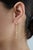 These chain drop earrings feature 1.92 carats of natural yellow sapphires, set in 14k yellow gold. The cushion-cut center...