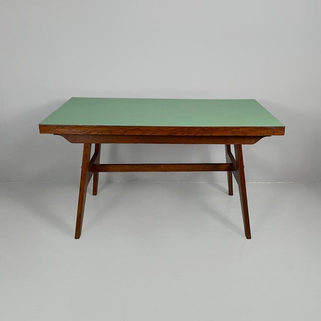 French mid-century modern oak dining table by René Gabriel, 1950s Dining table or desk made entirely of oak. The top is...