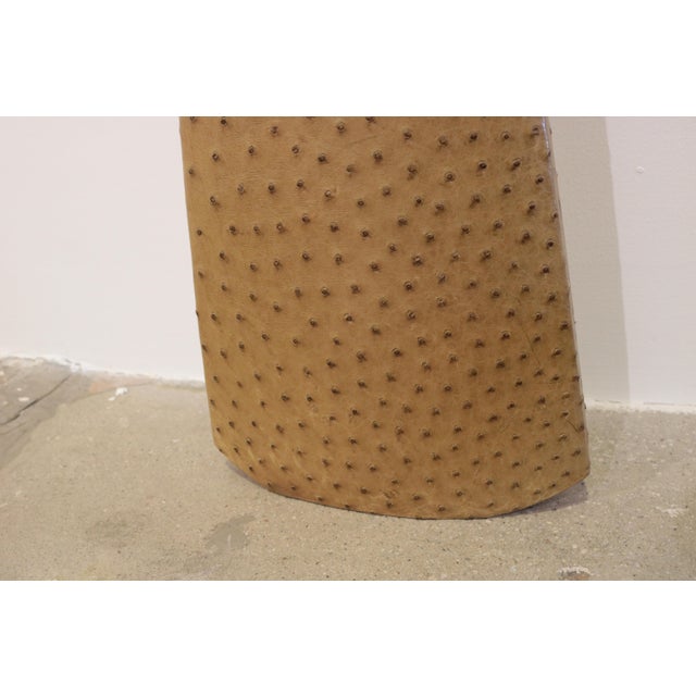 An R & Y Augousti designed vase and bowl set covered in ostrich leather. Signed underneath. Dimensions: Bowl: Height 6¼,...