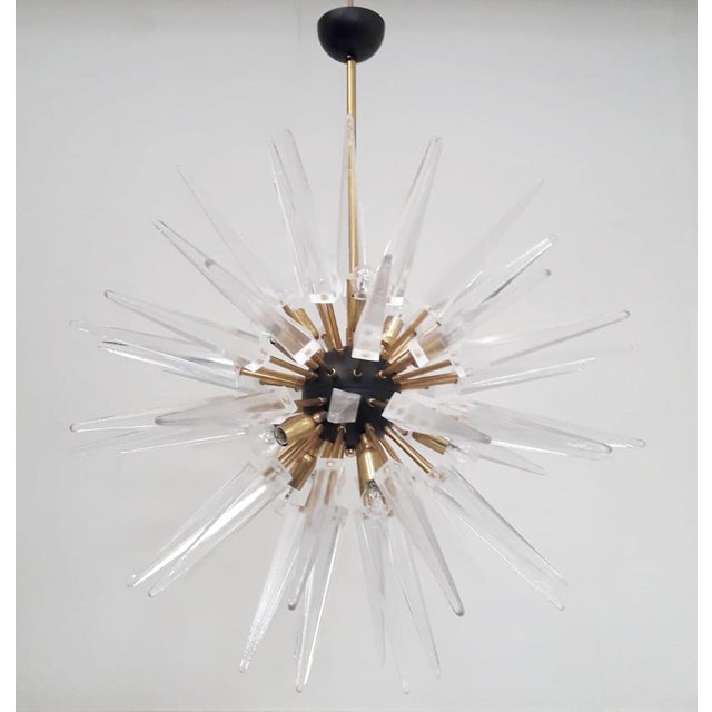 Italian modern sputnik chandelier with clear Murano glass shards spikes, mounted on natural unlacquered brass frame with...