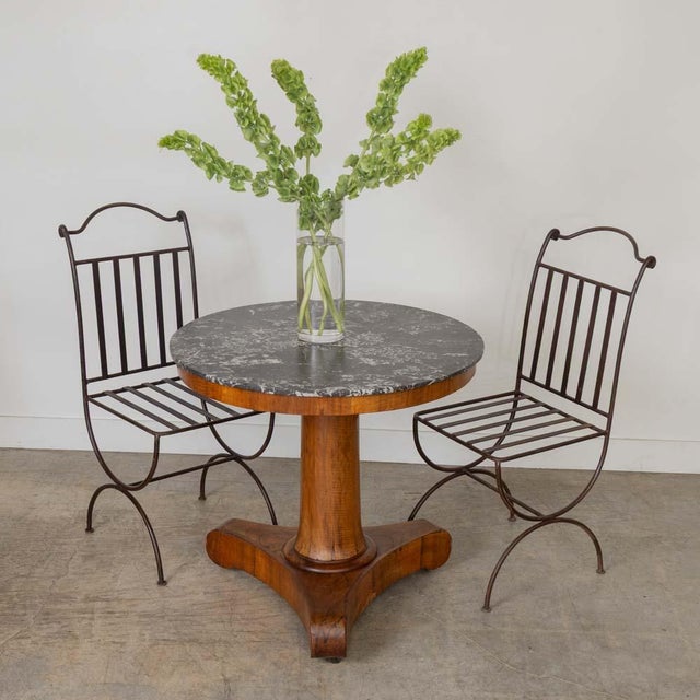 Lovely Art Deco wood and marble center table from France, 19th century. Beautiful black marble top with veins of white and...