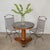 Lovely Art Deco wood and marble center table from France, 19th century. Beautiful black marble top with veins of white and...