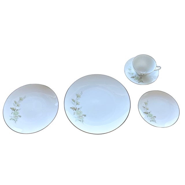 Seven, five‑piece, place settings in Noritake’s “Soroya” pattern (#6853), manufactured in Japan between 1967 and 1976....