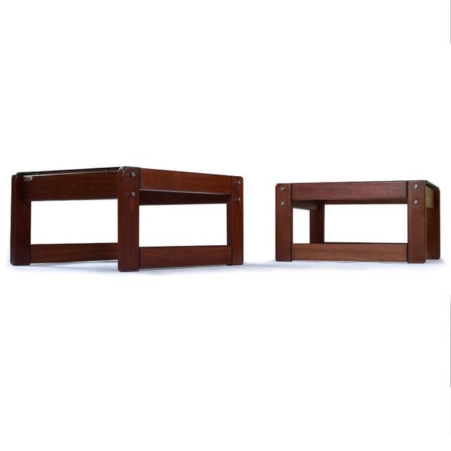 Pair of vintage 1970s Percival Lafer, Brazilian Modern side tables. The deep red hue rosewood bases support a rich smoked...