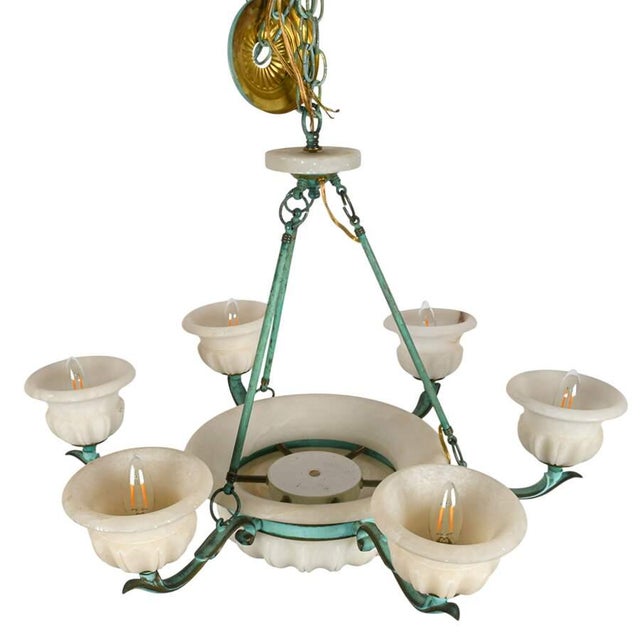 This elegant six-light chandelier beautifully combines sculptural bronze craftsmanship with the timeless beauty of carved...