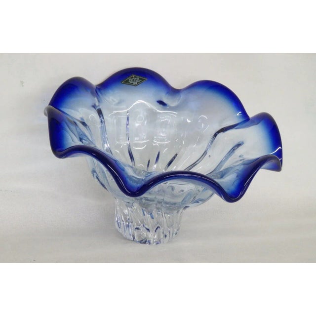 This gorgeous large bowl is made of crystal. This piece still has the original sticker indicating that it was hand made by...